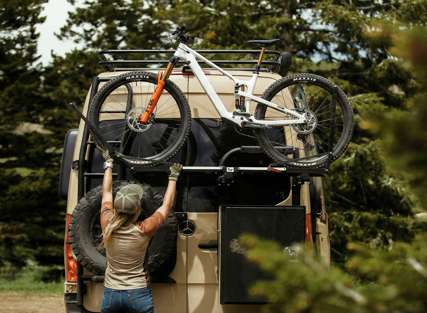 Person loading a mountain bike