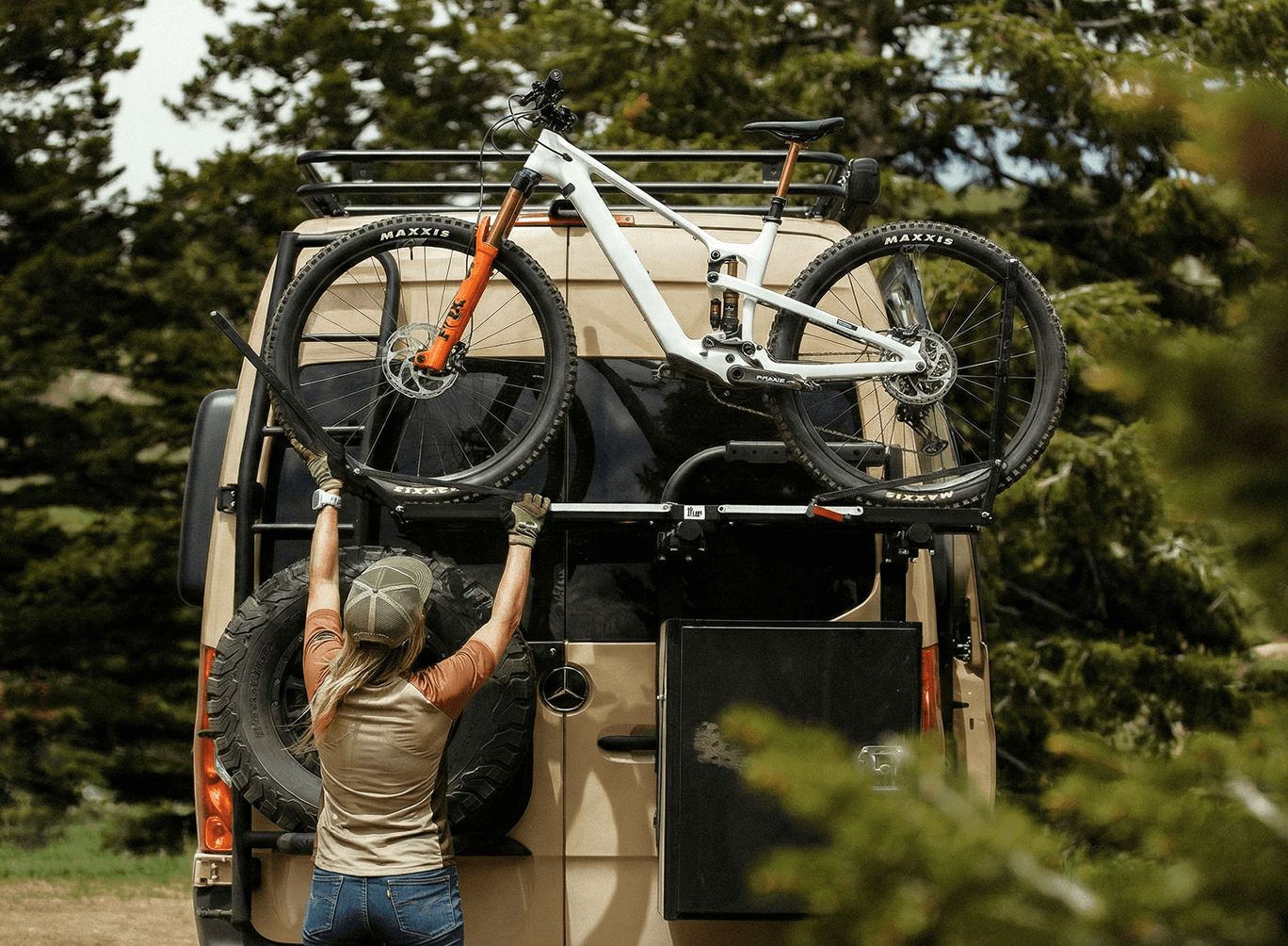 Person loading a mountain bike